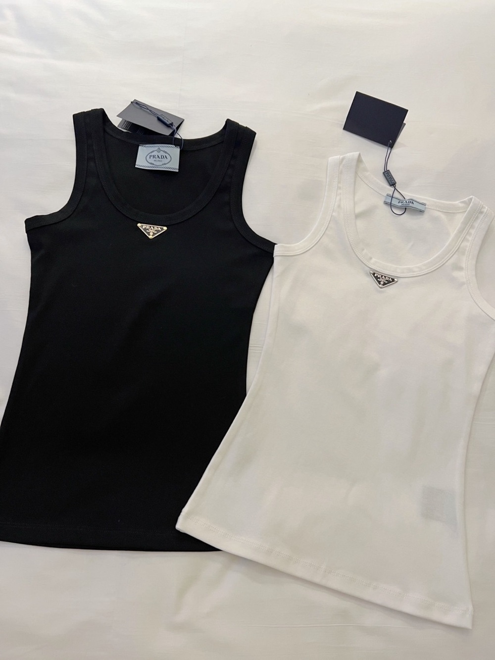 Prada white/black ribbed vest with a metal triangle logo
